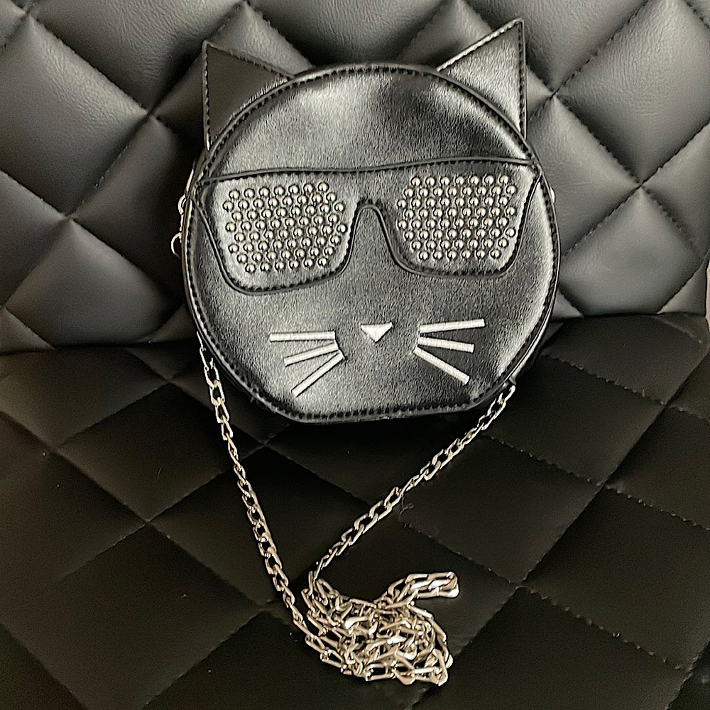 This is a cat cross body bag.